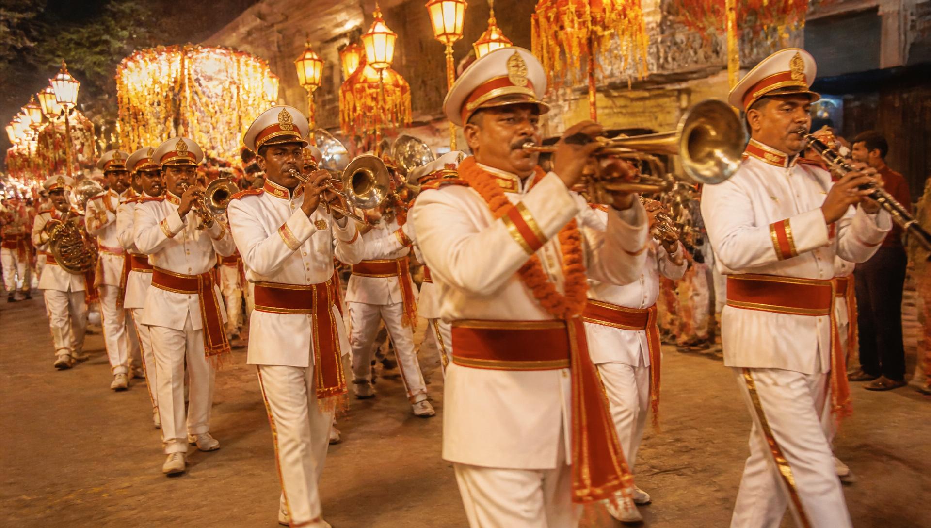 Indian brass baraat band marching in evening procession